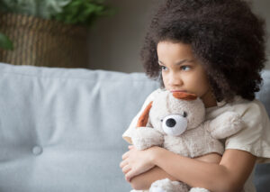 Child holding a teddy bear