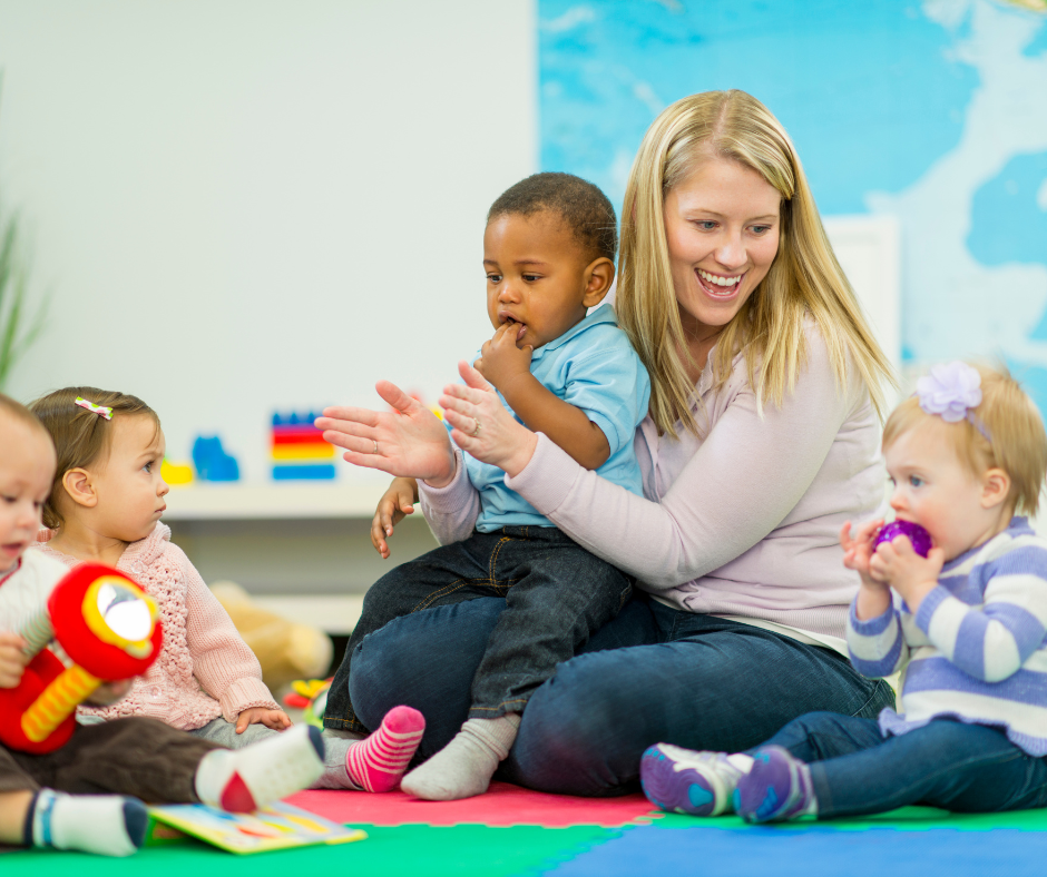 Image of teacher with toddlers