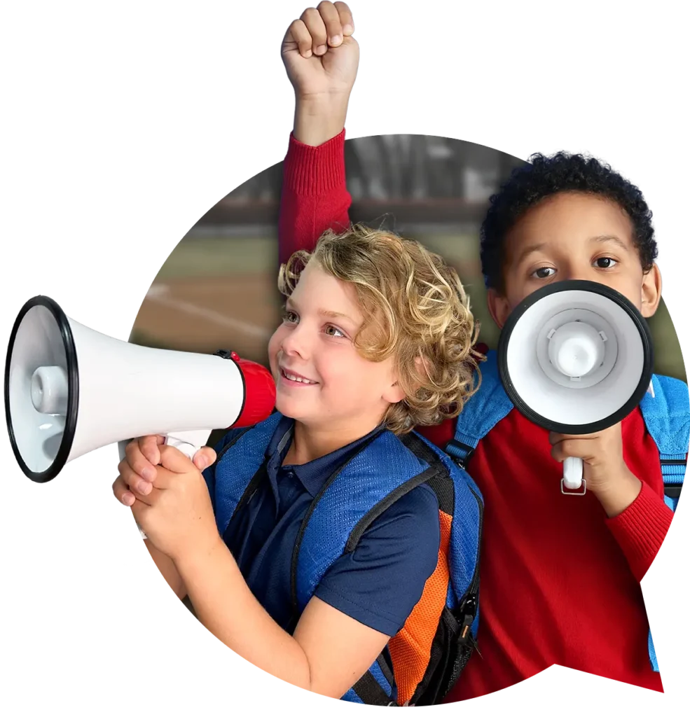 Two young boys speaking into megaphones