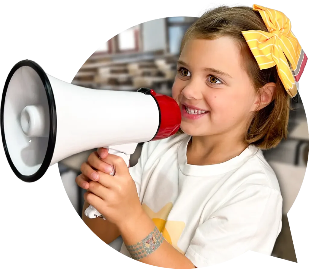 Young girl with a yellow ribbon in her hair holding a megaphone